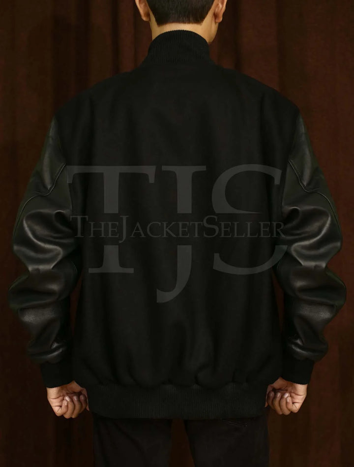 Black varsity jacket with snap button front closure