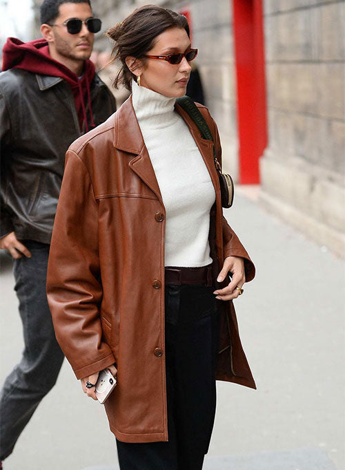 Bella Hadid looks stunning in a sleek leather trench coat in American style